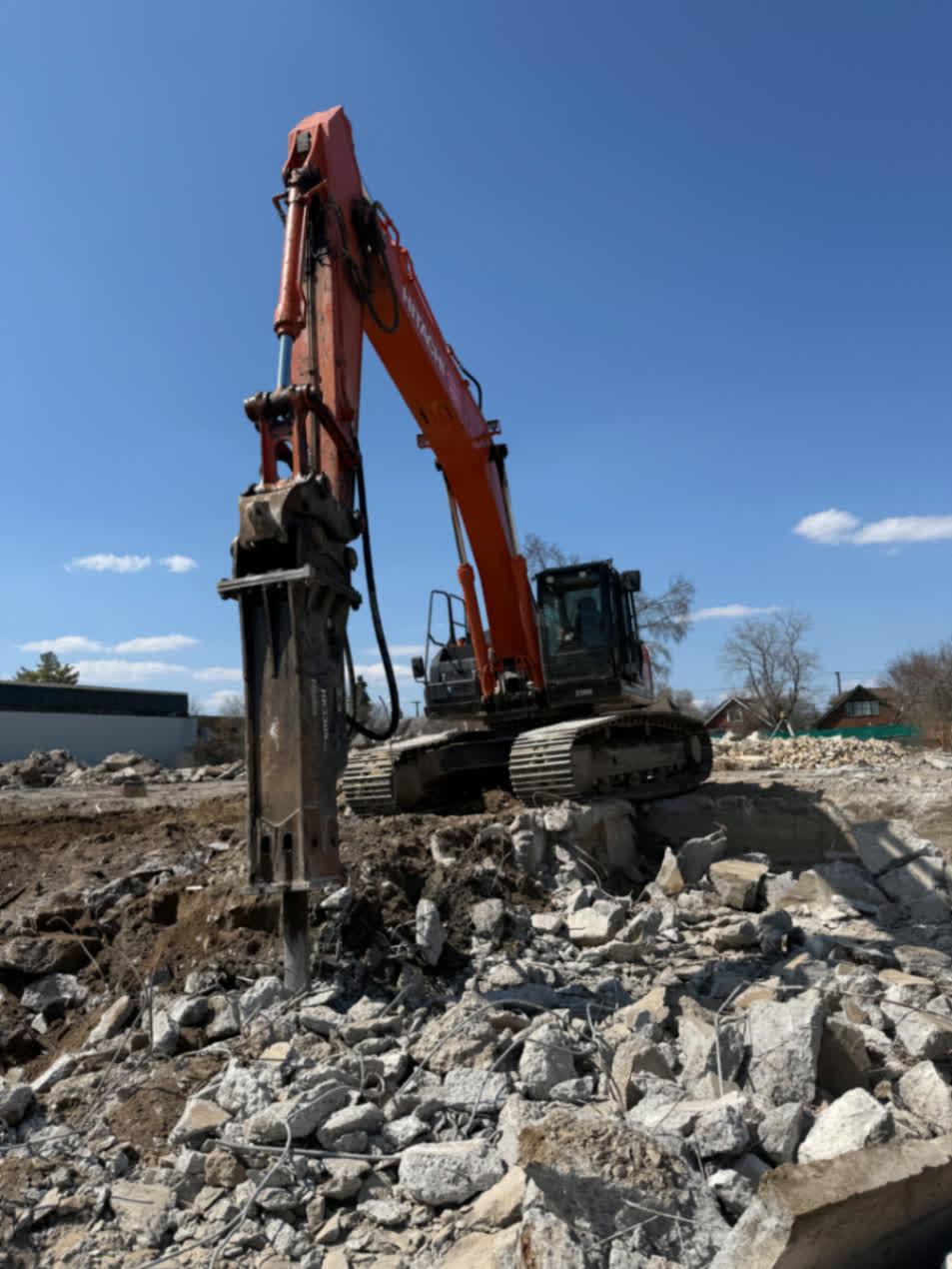 Demolition hammer attachment breaking concrete