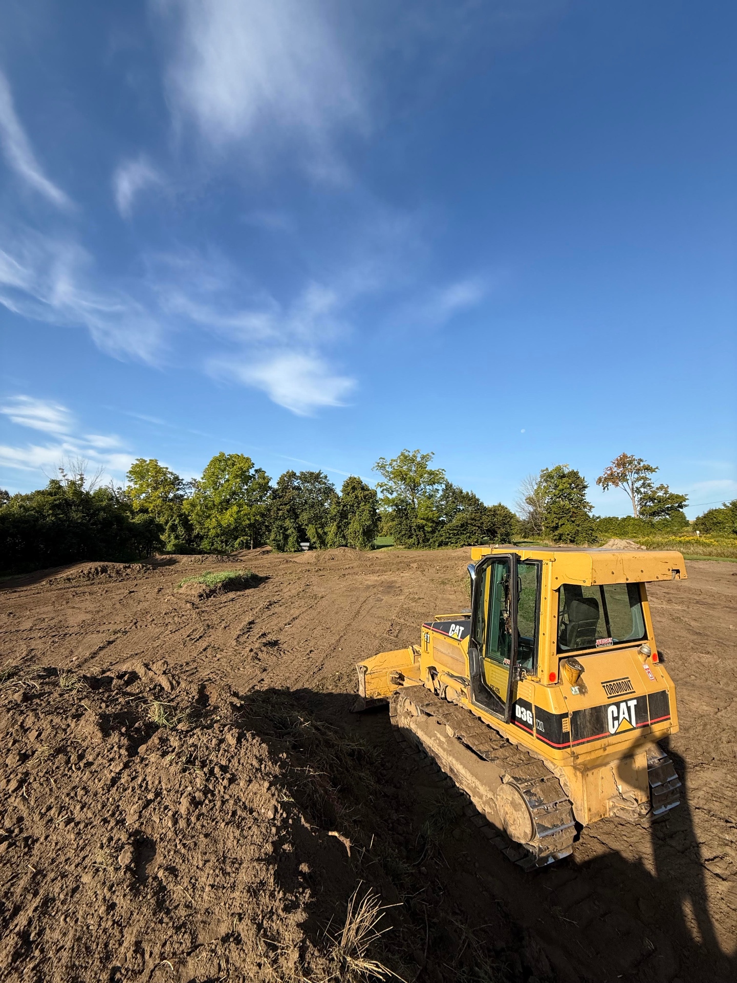Dozer completing grading work on open ground