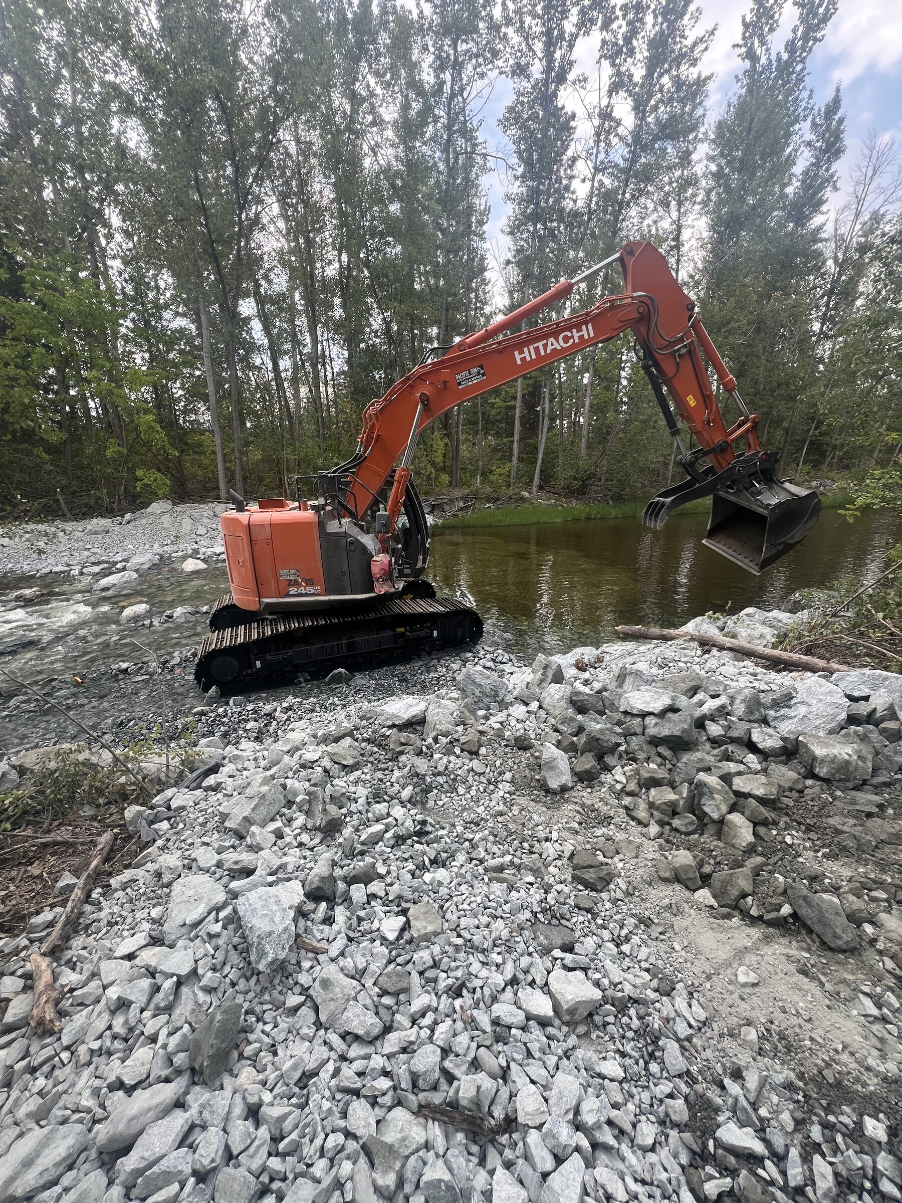 3SIXTY Excavation Hitachi excavator working in a river on an environmental remediation site