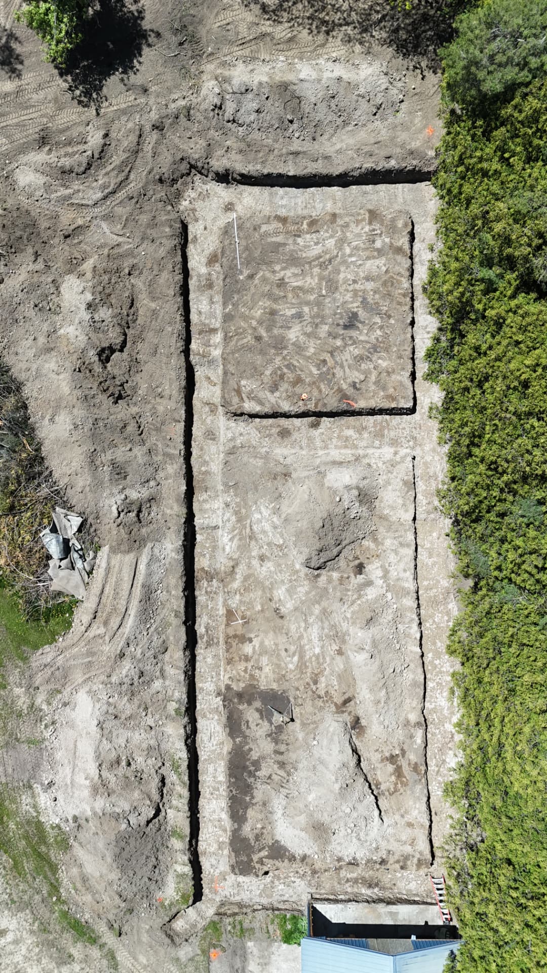 Aerial view of a foundation excavation footprint on a residential build