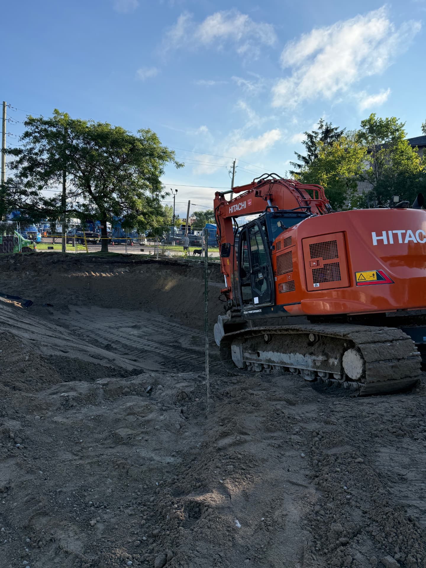 Hitachi excavator completing foundation excavation on a Durham Region build site